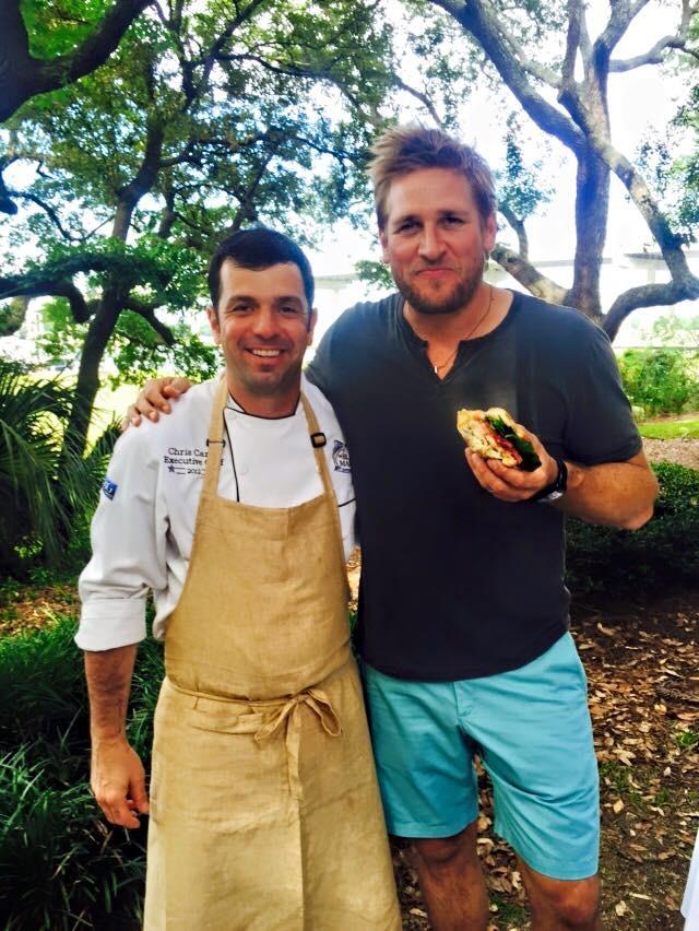 two men holding food