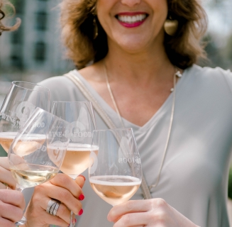 women holding wine glass