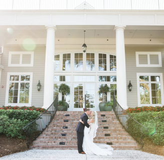 couple embracing in frnt of a building