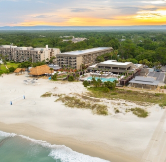aerial shot of beach house resort and beach