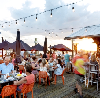 guests enjoying meals on patio 