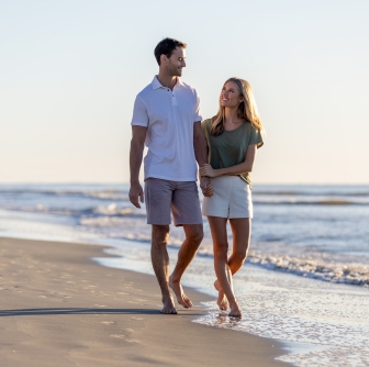 couple on beach walk 