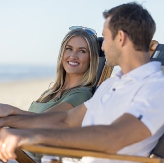couple sitting on the beach 