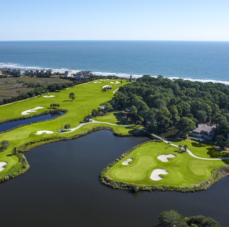 aerial view of a golf course close to the beach
