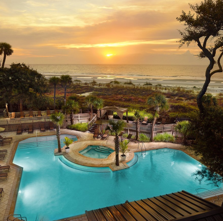 pool with a sunset behind