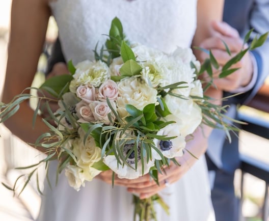 bouquet of flowers being held by a bride