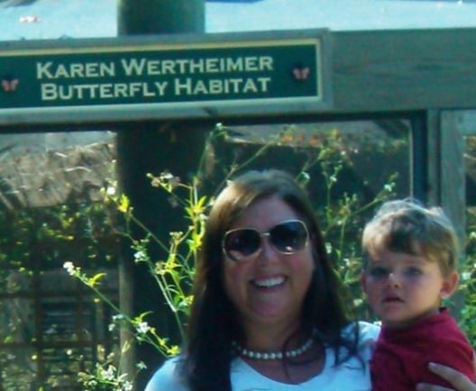 mom and son in front of butterfly exhibit