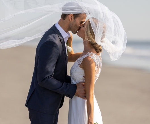 couple kissing on the beach