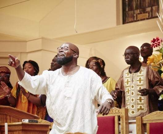 group of people singing in a choir