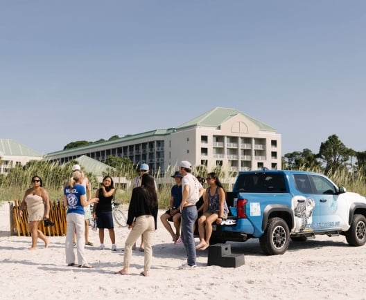 cadence on the beach for a turtle talk with the sea turtle patrol