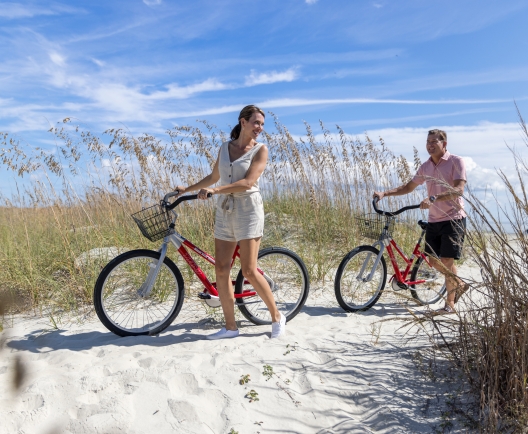 Couple walking with bikes