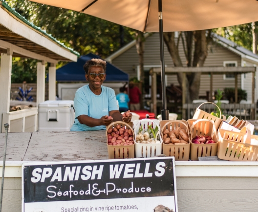 Woman and her produce stand 