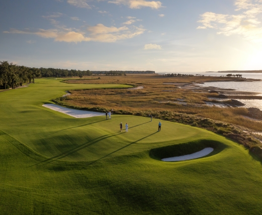 Aerial golf course shot with people playing 