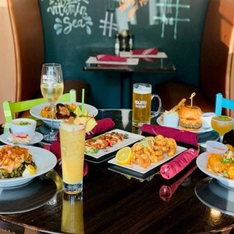 table with lots of food and drinks