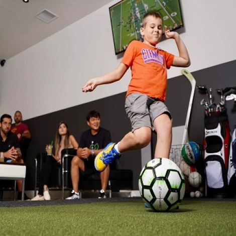 child playing with a soccer ball