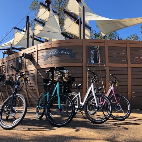 bikes in front of a ship in a playground
