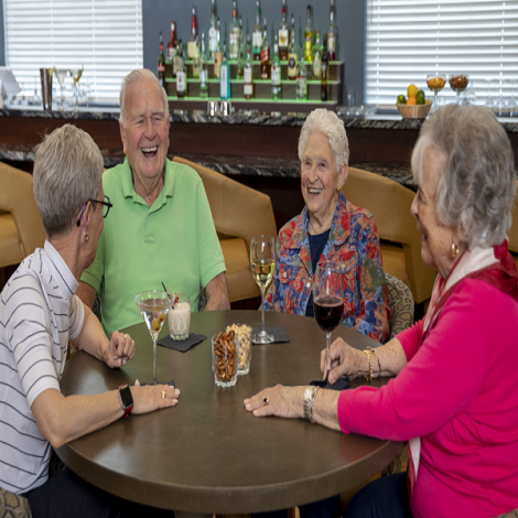 elderly people sitting around a table