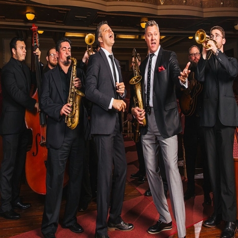 group of people playing instruments and singing