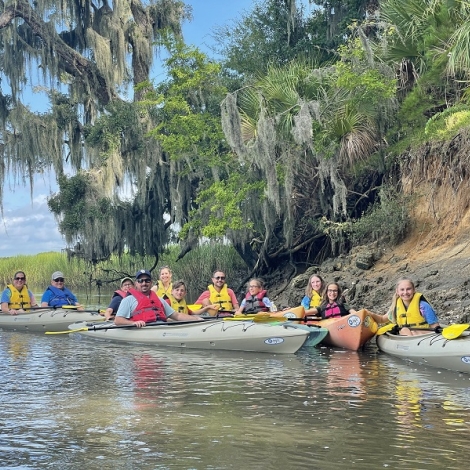 group of people in kayaks