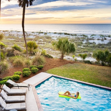 woman on a pool float in a pool