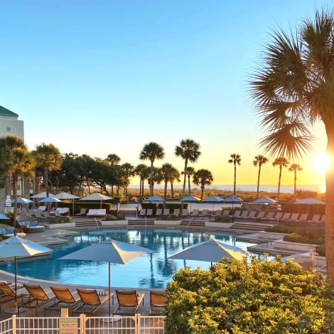 westin pool with umbrellas and palm trees