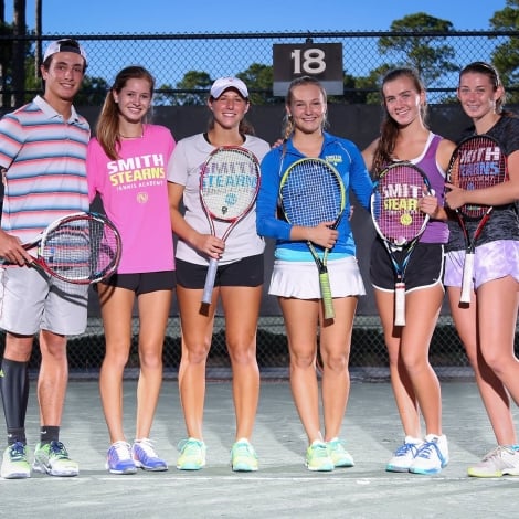 group playing tennis 