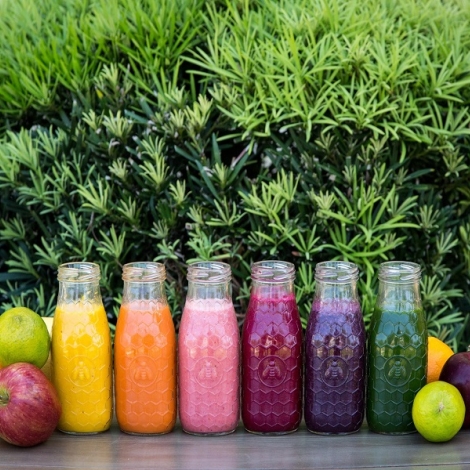 Line up of colourful smoothies and juices 