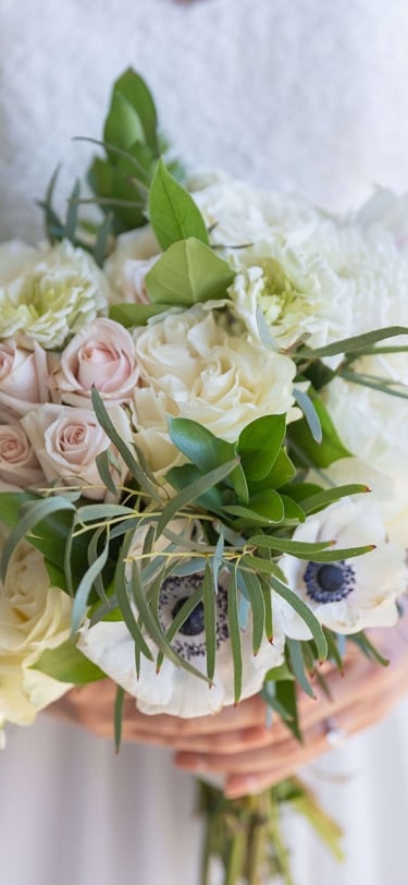 bouquet of flowers being held by a bride