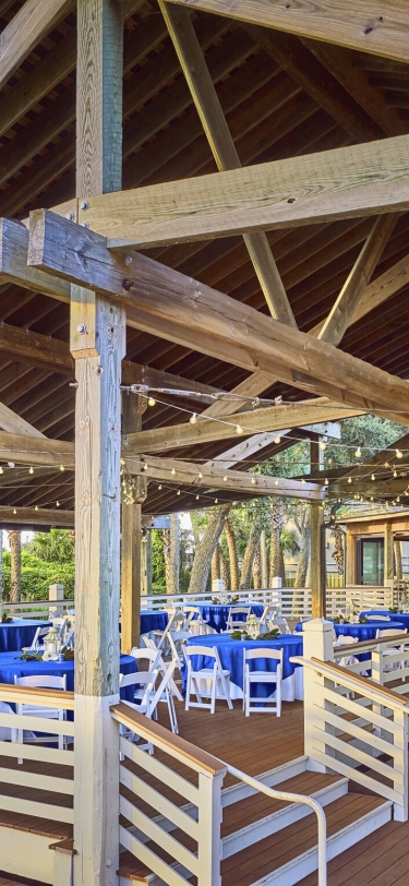open air space with tables set up for a large group