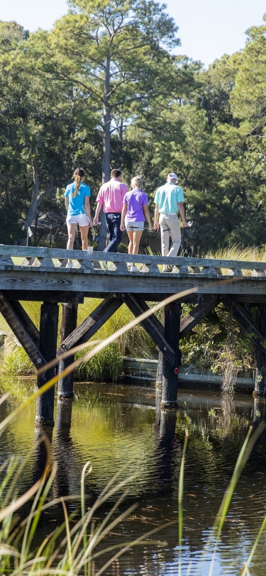 People walking across a bridge