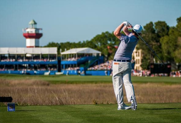 Golfer holds his stance post swing