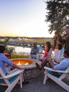 group of people around a firepit
