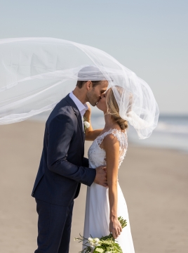 couple kissing on the beach