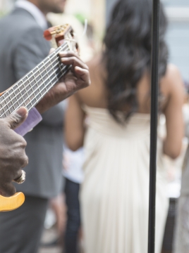 person playing guitat at a wedding party