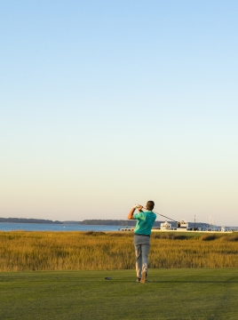 three people golfing 