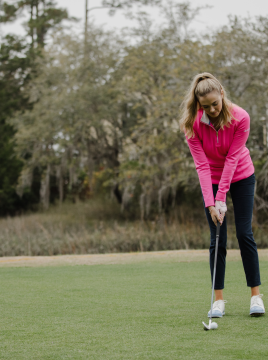 woman in a pink shirt putting 