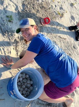 Woman working for Sea Turtle Patrol helping turtle nests 