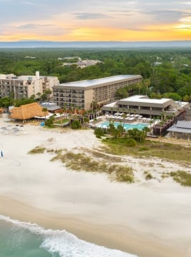 aerial shot of beach house resort and beach