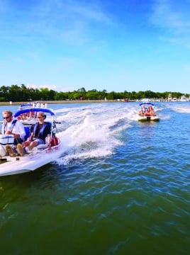 People in peddle boats