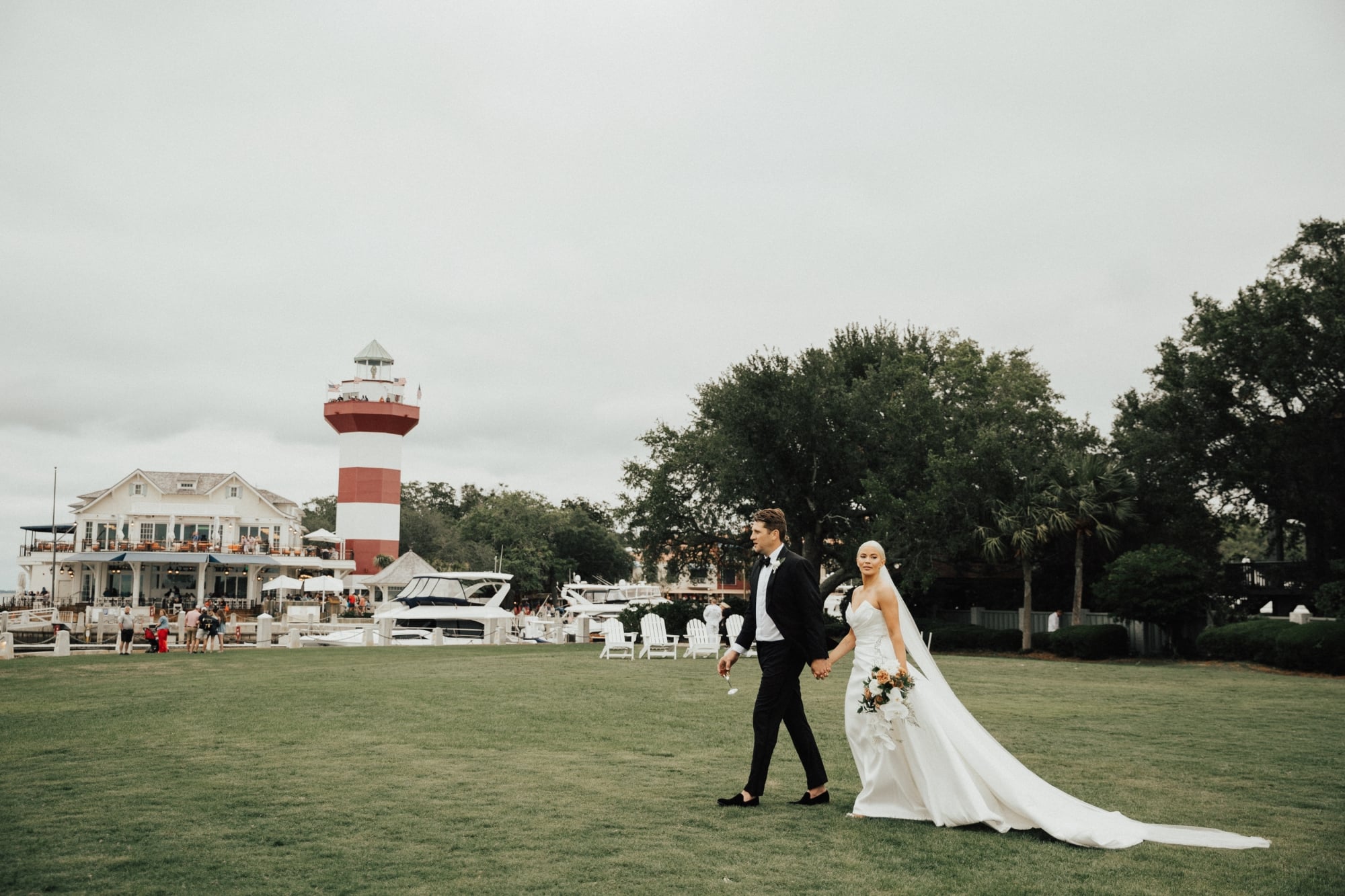 couple walking on a golf course after getting married