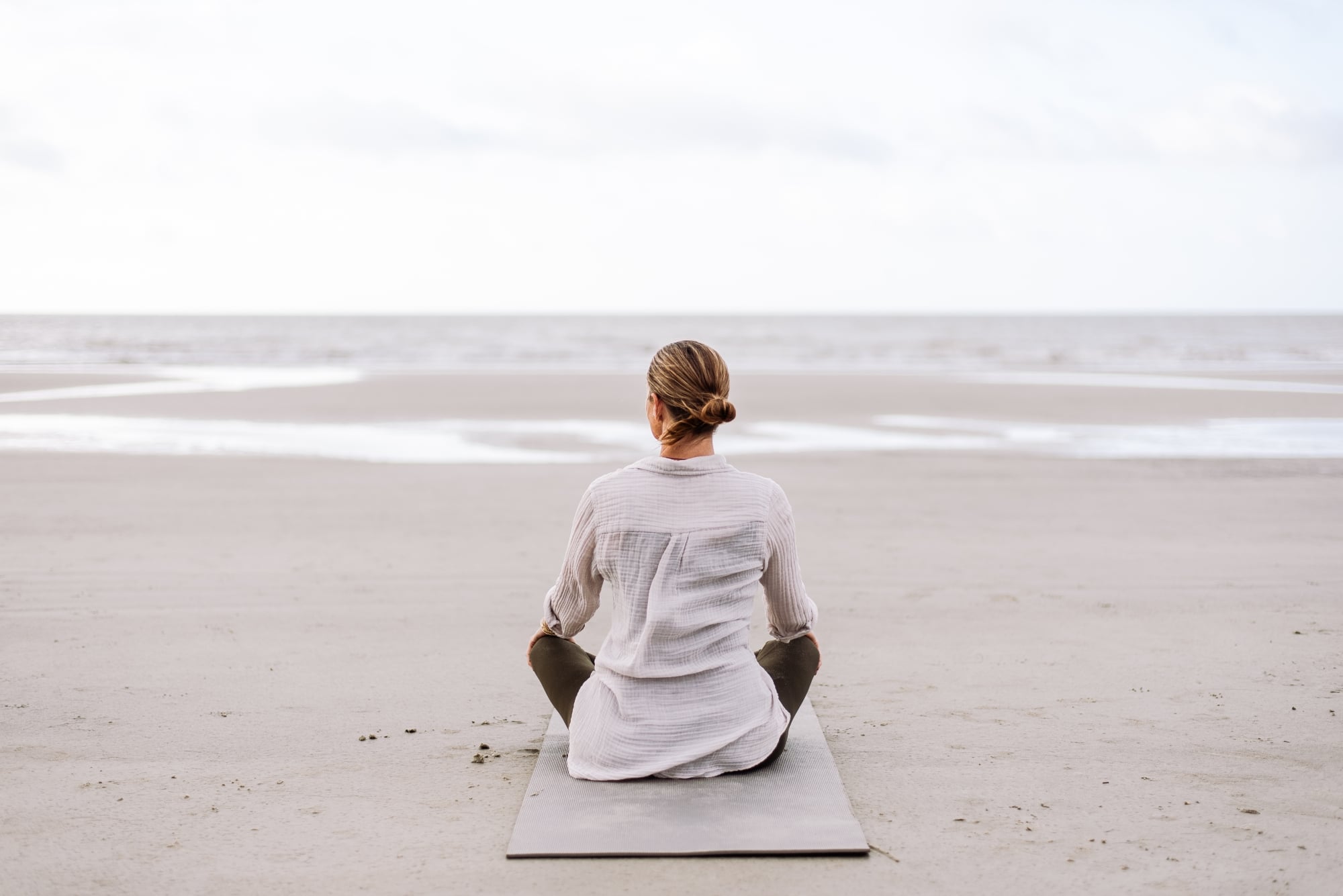 woman sitting on the beach