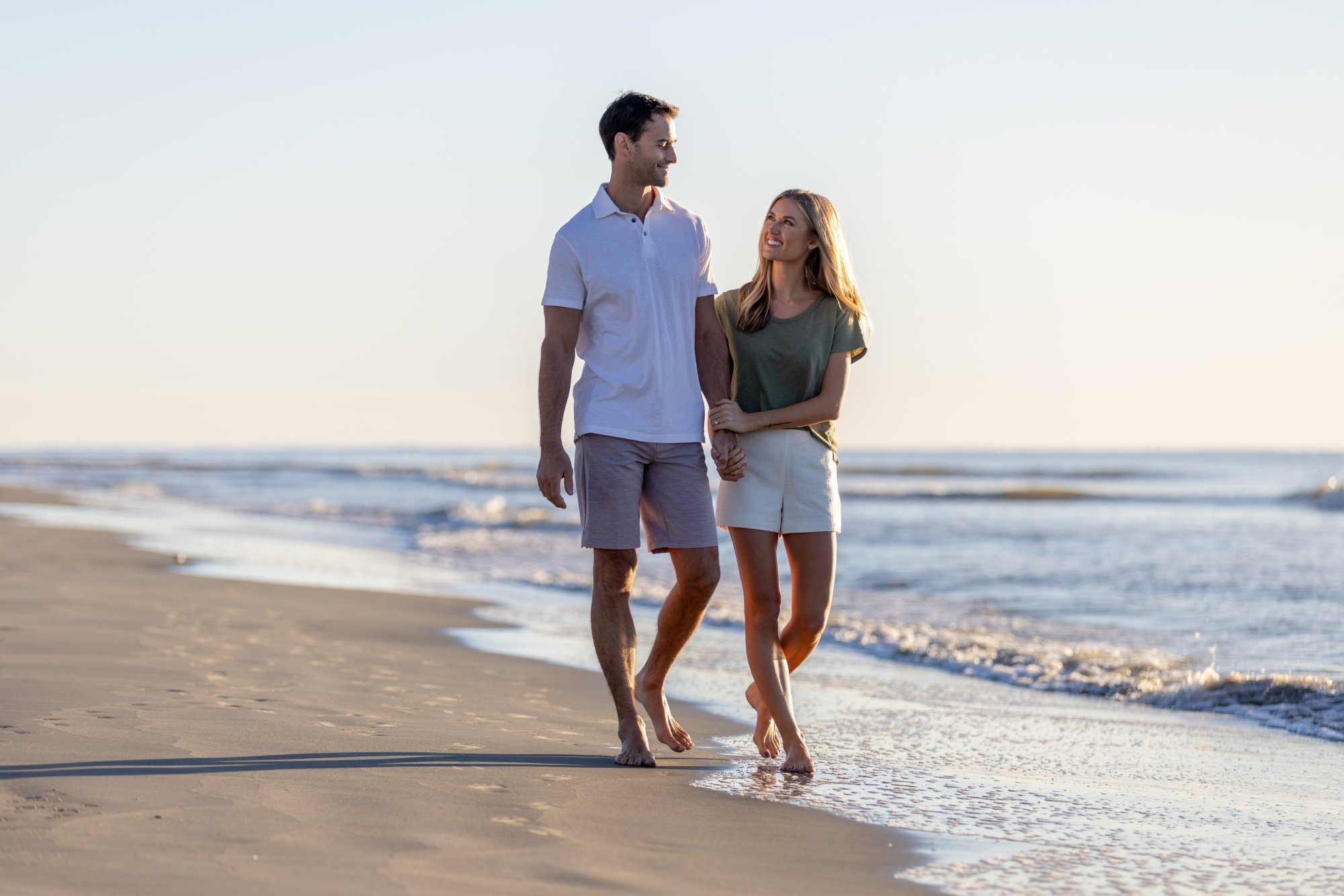 Couple Walking Down Beach 