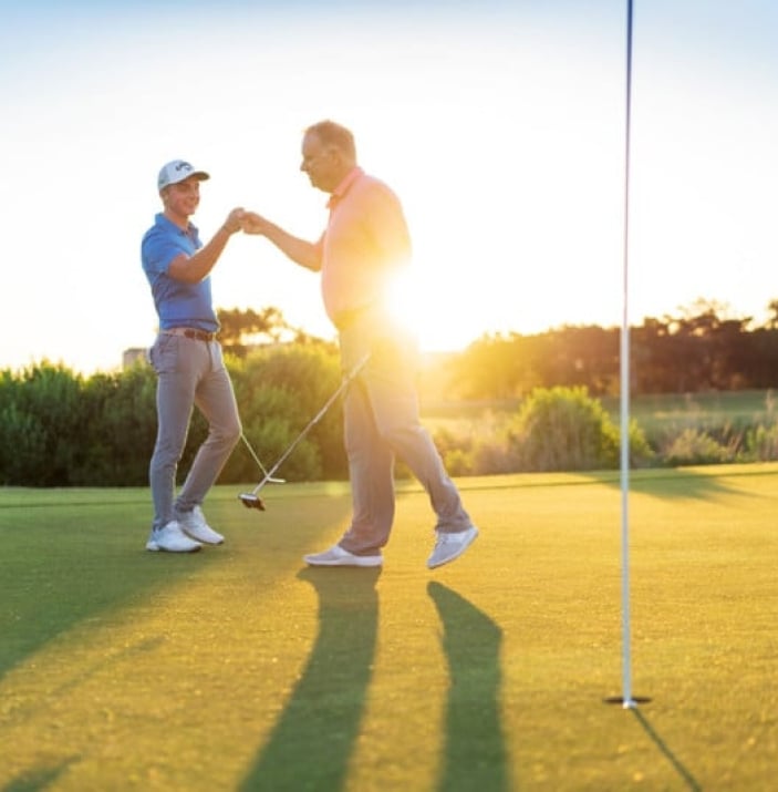 Group Golf Play Package at Palmetto Dunes - PD-Golf-Put-Sunflare-FistBump-web New