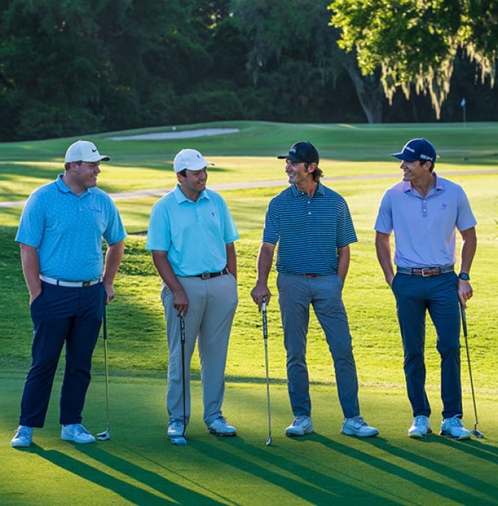 four male golfers standing on hole 14 of George Fazio Golf Course